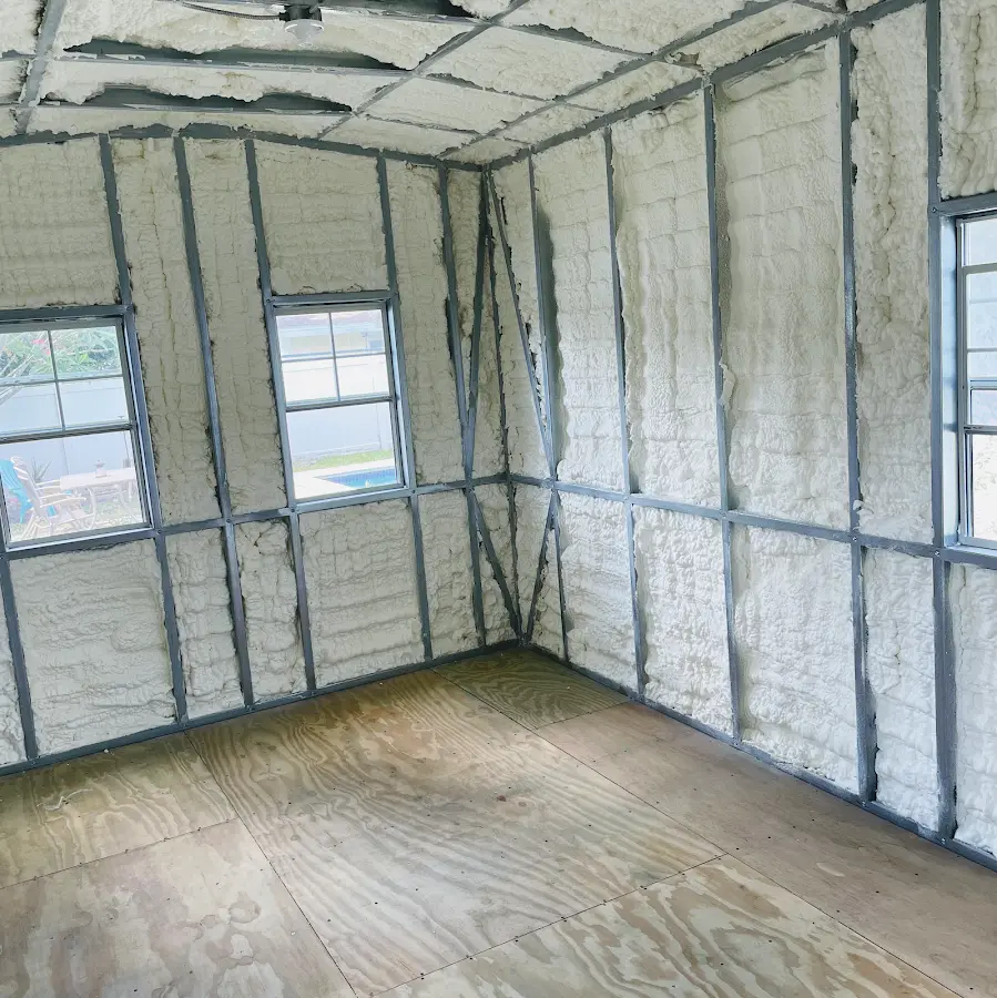 Closed-cell spray foam insulation applied to wall cavities in a residential project in Falmouth